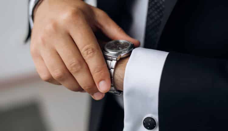Close-up of a businessman wearing a luxury watch, embodying American elegance and sophistication.